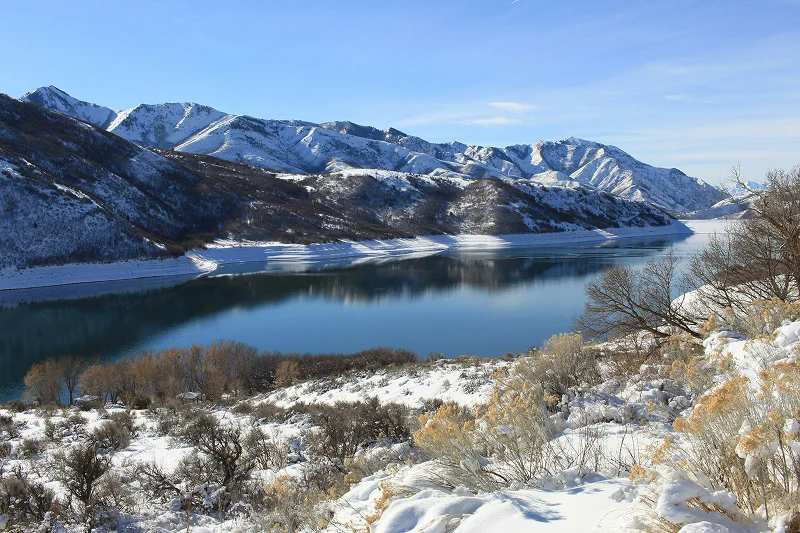 Snow-covered mountains and reservoir near Alta, Utah