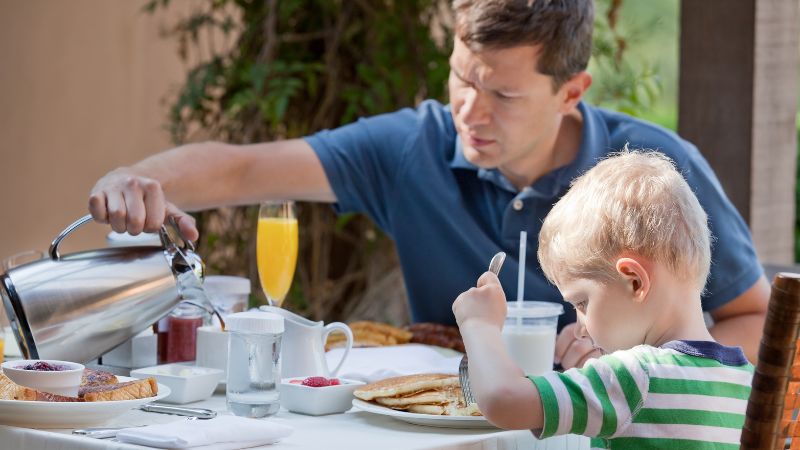 a father and son eating brunch